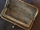 an image of a metal purse sitting on top of a table