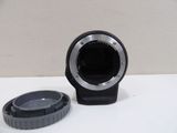 a camera lens and a lens cap sitting on a table