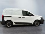 the white van is parked on the concrete floor in the room