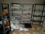 a room that has a bunch of shelves in it