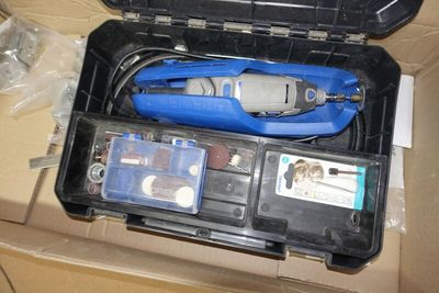 a box with a tool in it that is sitting on top of a table