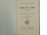 a close up of an open book with a black and white cover