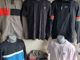 a lot of clothing on display in a store