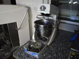a mixer and a blender sitting on a counter in a kitchen