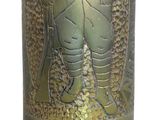 a gold vase with a picture of a man on it