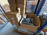 many boxes of assorted metal items in a warehouse