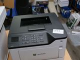 a printer that is sitting on a desk next to a printer