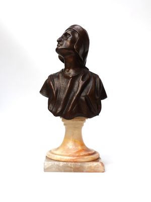 an antique bronze bust of a woman on a marble base