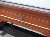 a piano that is sitting on the floor