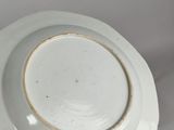 a white plate with a blue and white design on it