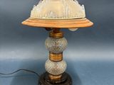 an image of a table lamp with a glass dome on top