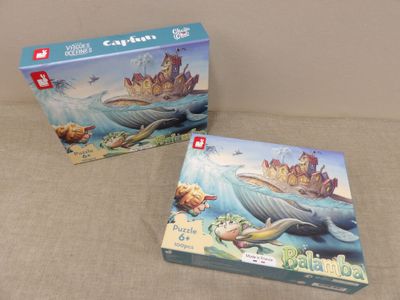 two puzzles are sitting on a table next to each other