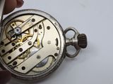 a close up of a pocket watch being held by a person