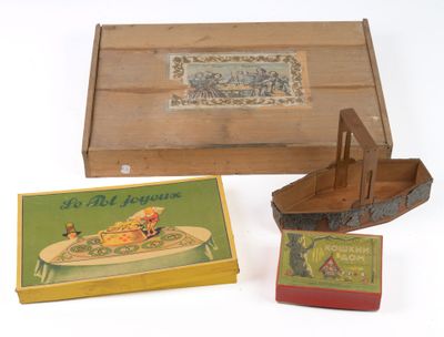 une petite boîte en bois avec l'image d'un bateau et une boîte d'allumettes