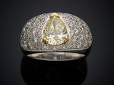 a close up of a diamond ring on a black surface