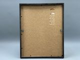 a close up of a picture frame with a piece of cardboard in it