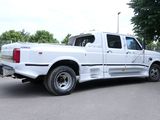 a white truck that is parked in the parking lot