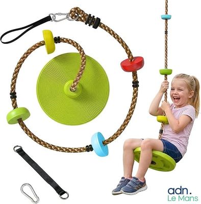 a little girl that is sitting on a swing