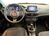 the interior of a car with a steering wheel, dashboard, and dashboard controls