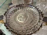 many glass dishes on a glass table in a room