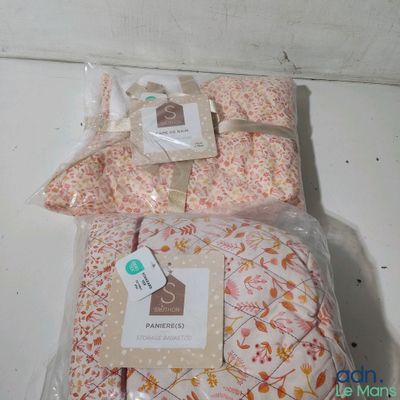 several pieces of pink and orange fabric wrapped in plastic bags