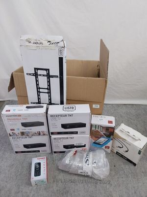 several boxes of electronic devices are sitting on the floor