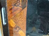 a close up of a mirror with a wooden frame