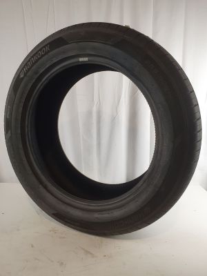 a close up of a tire on a white surface