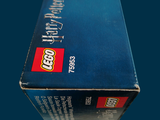 a box of legos sitting on a blue surface