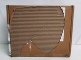 an open cardboard box sitting on top of a white surface
