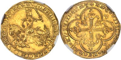 a gold coin with a cross on the front and an image of a man on a horse on the back