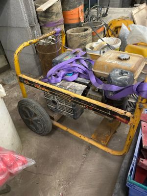 a yellow cart with tools on it in a garage