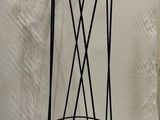 wrought iron coat rack with multi colored balls on it