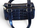 navy blue leather handbag on white background