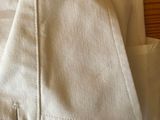 a close up of a white shirt on a wooden table