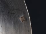 a close up view of a metal object with holes in it