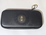 an image of a black case with a gold emblem on it