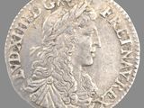 une pièce d'argent à l'effigie d'une femme coiffée d'une couronne