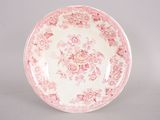 a pink and white plate with a floral design on it