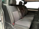 the back seats of a car are grey and black in color