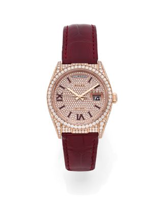a lady ' s watch with diamonds and red leather strap