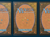 three decks of magic the gathering deck are shown in three different positions