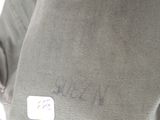 a man with a backpack that has a tag on it