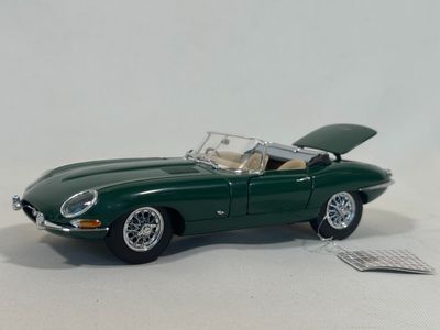 a toy car that is sitting on a white surface