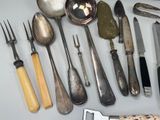 many different types of silverware on the table