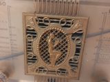 a clock that is on display in a glass case