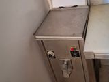 an image of a small kitchen with a sink and a stove