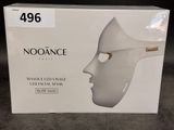 a box with a white mask on it on the floor