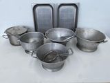 a lot of pots and pans sitting on a table