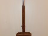 a wooden stand with a baseball bat on top of it